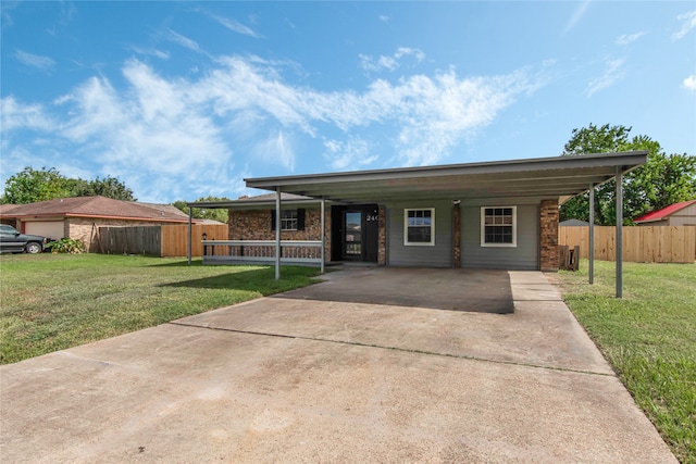 ranch-style house with a front lawn and a carport