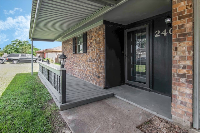 doorway to property featuring a porch