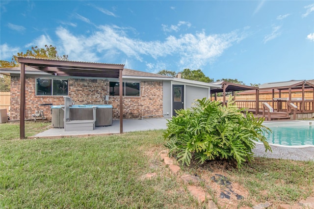 rear view of property featuring a yard