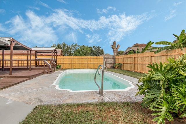 view of swimming pool featuring a deck