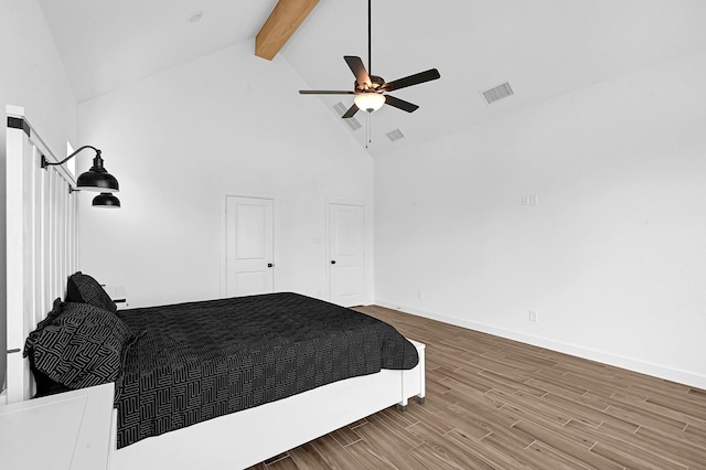 bedroom featuring ceiling fan, high vaulted ceiling, beam ceiling, and hardwood / wood-style floors