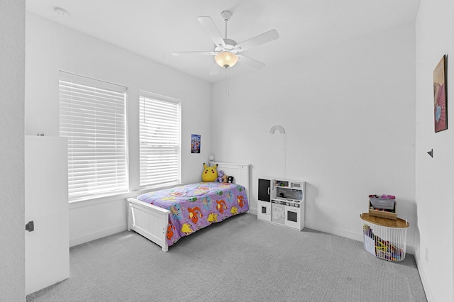 carpeted bedroom featuring ceiling fan