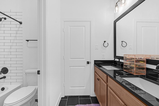 full bathroom featuring tiled shower / bath, toilet, tile patterned floors, and vanity