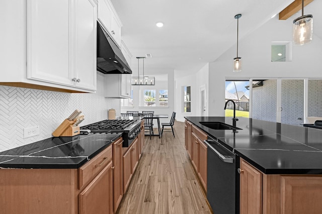 kitchen featuring hanging light fixtures and white cabinets