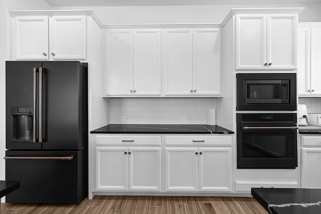 kitchen with white cabinets and black appliances