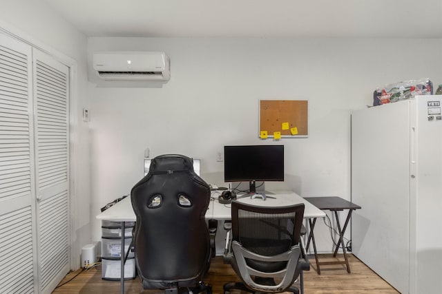 office featuring hardwood / wood-style floors and an AC wall unit