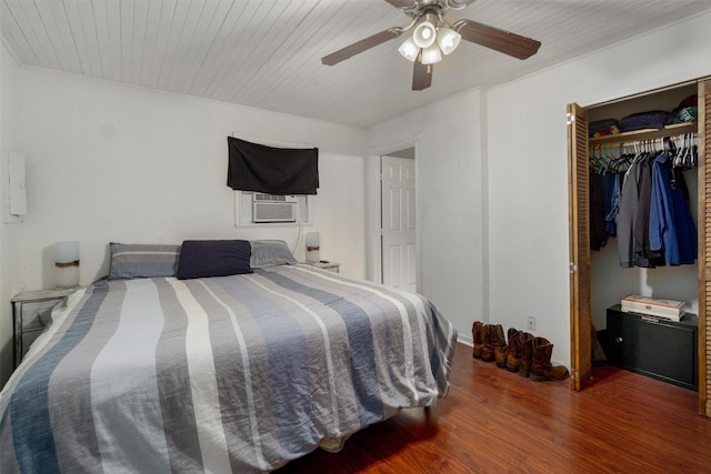 bedroom featuring ceiling fan, a closet, cooling unit, and dark wood-type flooring