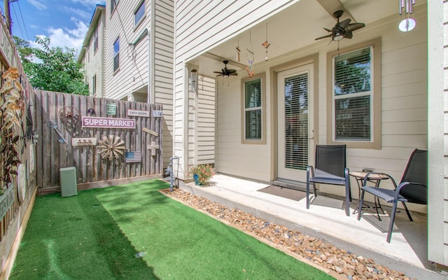 view of yard featuring ceiling fan and a patio area