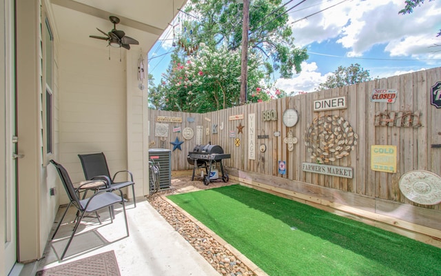 view of patio with grilling area, central AC unit, and ceiling fan