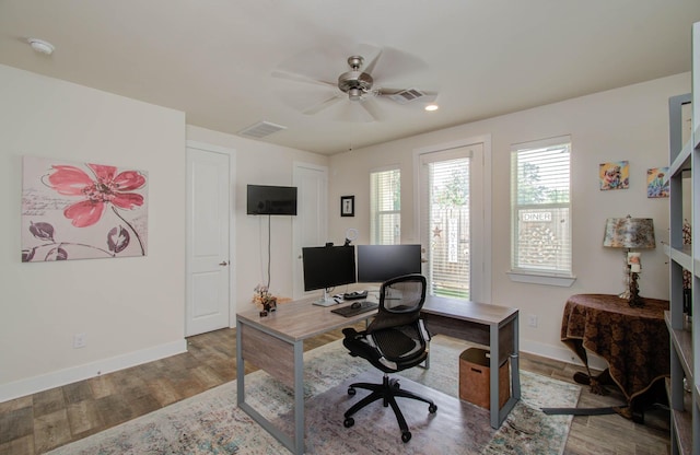 office space with ceiling fan and light hardwood / wood-style floors