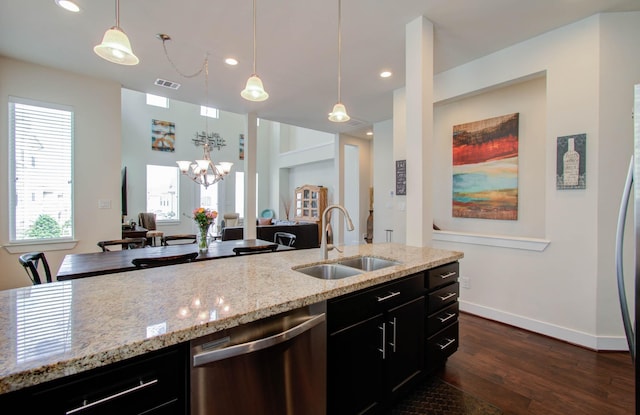 kitchen featuring dishwasher, sink, hanging light fixtures, dark hardwood / wood-style floors, and a notable chandelier