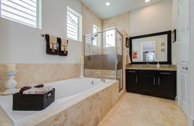 bathroom with tile patterned flooring, vanity, and plus walk in shower