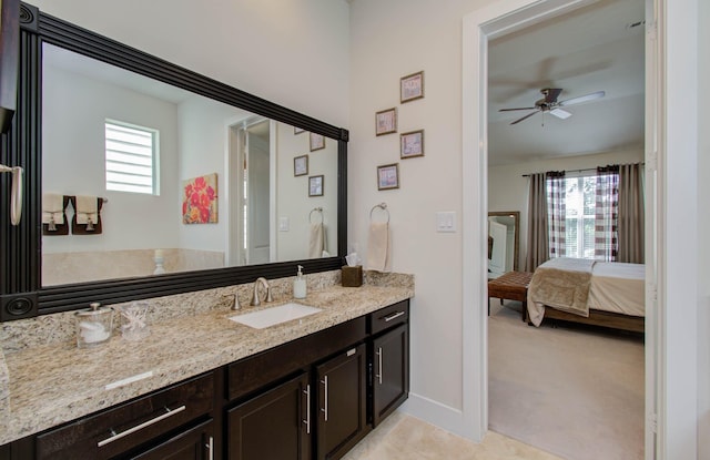 bathroom with plenty of natural light, ceiling fan, and vanity