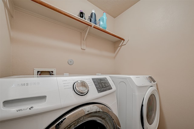 laundry room with washer and clothes dryer