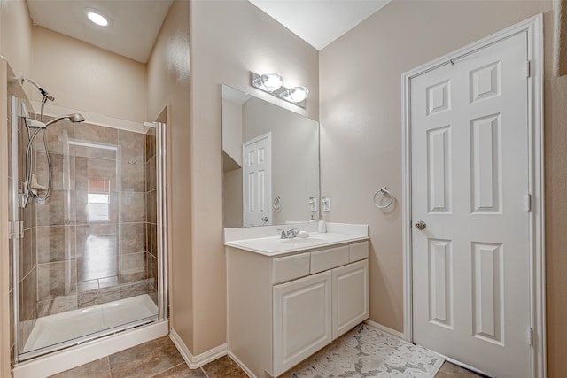 bathroom with vanity, tile patterned flooring, and walk in shower