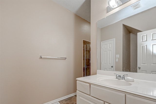 bathroom with vanity and tile patterned floors