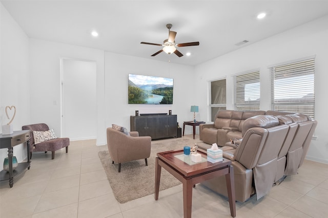 living room featuring light tile patterned flooring and ceiling fan