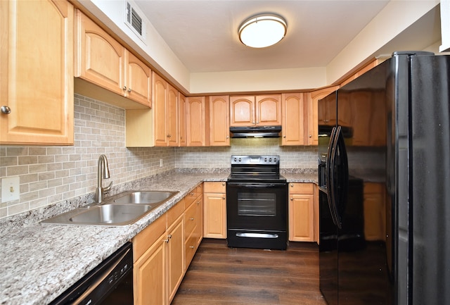 kitchen with dark hardwood / wood-style floors, light brown cabinetry, sink, and black appliances