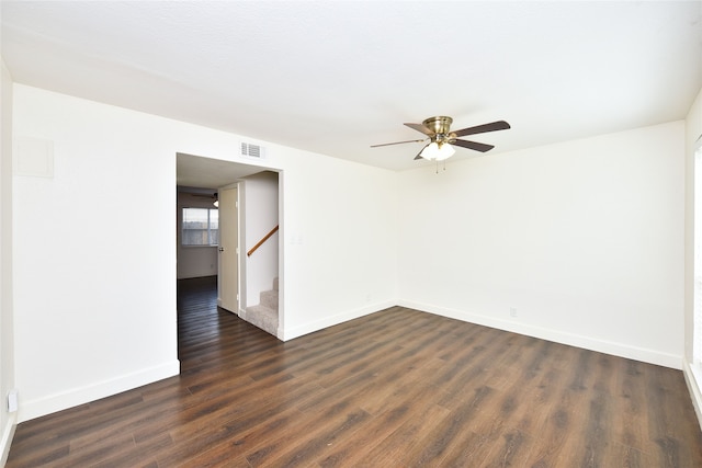 spare room with ceiling fan and dark hardwood / wood-style flooring