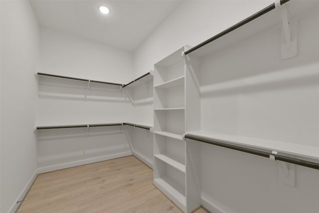 walk in closet featuring light hardwood / wood-style floors