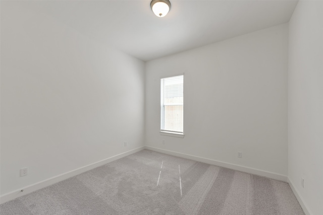 empty room with light colored carpet