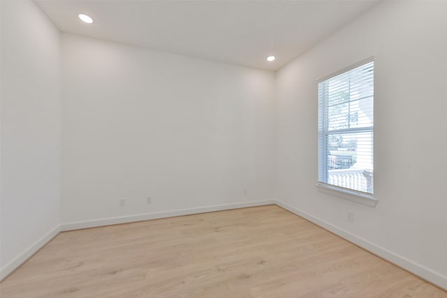 spare room featuring light hardwood / wood-style flooring