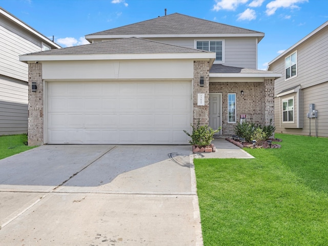 view of front of home featuring a garage and a front lawn