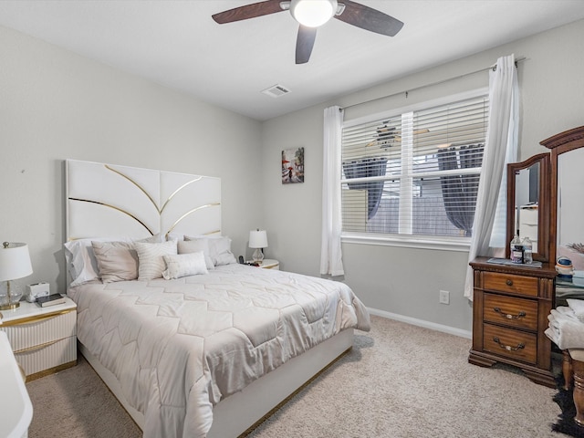 bedroom featuring light carpet and ceiling fan