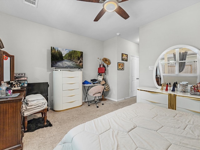 bedroom with light carpet and ceiling fan