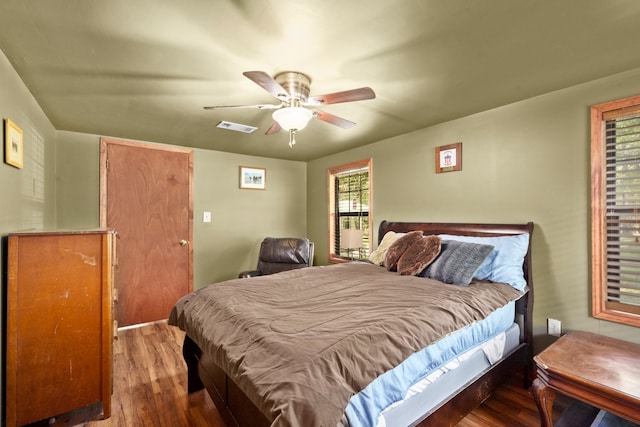 bedroom with ceiling fan and wood-type flooring