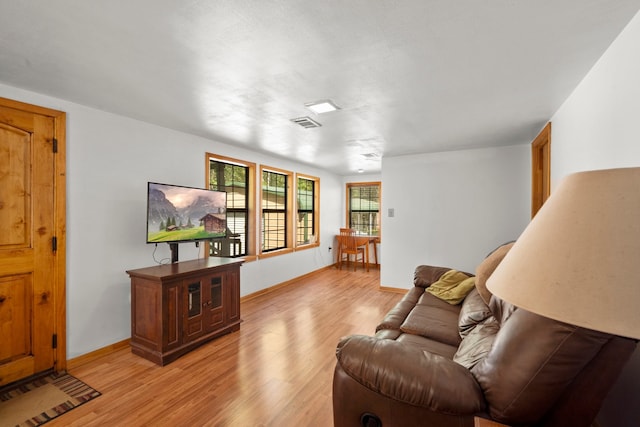 living room with light hardwood / wood-style floors