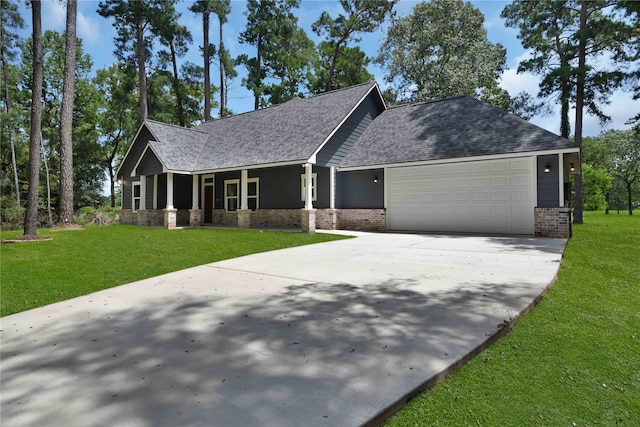 craftsman inspired home with a garage and a front yard