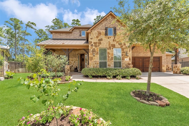 craftsman inspired home featuring a front yard and a garage