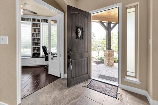 entryway featuring ceiling fan and a healthy amount of sunlight