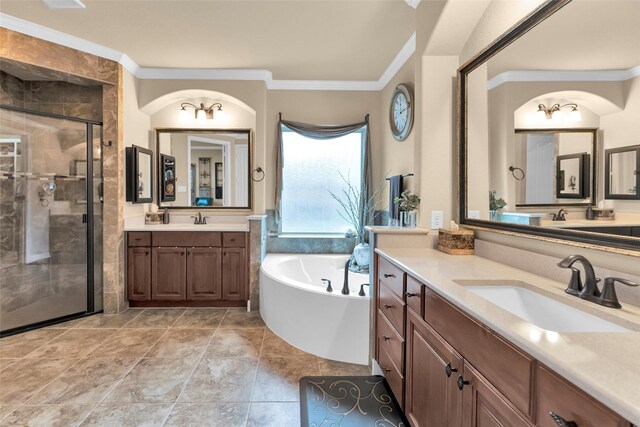 bathroom featuring vanity, ornamental molding, and shower with separate bathtub