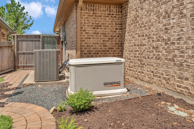 203 Gaillardia Ct, Pinehurst, TX 77362 - exterior view of a power unit, central AC, brick siding, and fence
