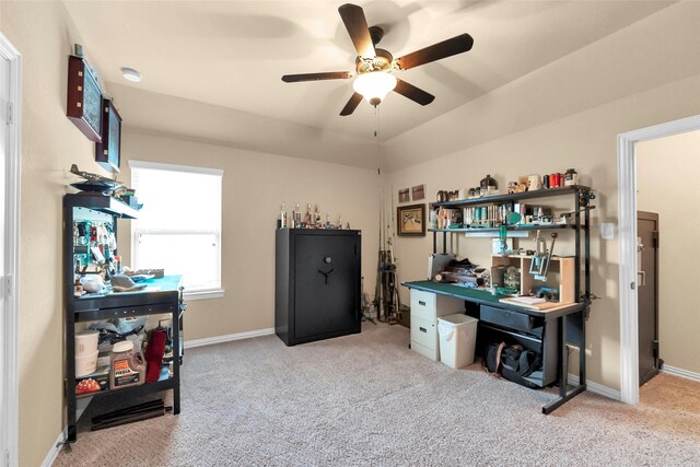 carpeted office space with ceiling fan