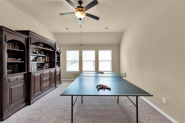 playroom featuring lofted ceiling, light colored carpet, and ceiling fan