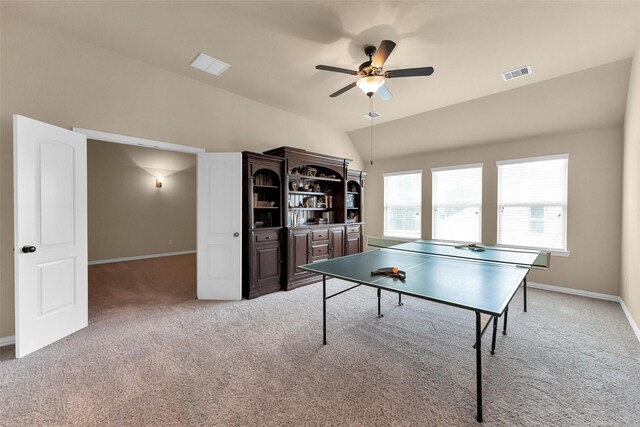 game room with ceiling fan, lofted ceiling, and light carpet