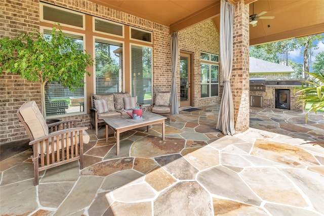 203 Gaillardia Ct, Pinehurst, TX 77362 - view of patio featuring exterior kitchen, grilling area, a ceiling fan, and outdoor lounge area