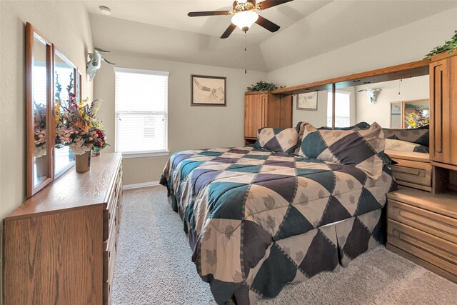 carpeted bedroom featuring lofted ceiling