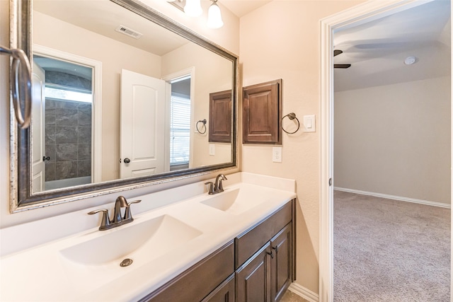 203 Gaillardia Ct, Pinehurst, TX 77362 - bathroom featuring plenty of natural light, double vanity, and baseboards