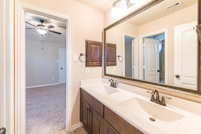 203 Gaillardia Ct, Pinehurst, TX 77362 - full bath with double vanity, a ceiling fan, and baseboards