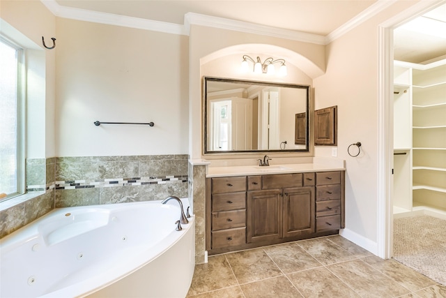 203 Gaillardia Ct, Pinehurst, TX 77362 - bathroom with healthy amount of natural light, ornamental molding, a whirlpool tub, vanity, and a spacious closet