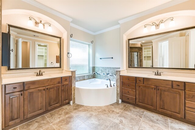 203 Gaillardia Ct, Pinehurst, TX 77362 - full bath with crown molding, two vanities, and a bath