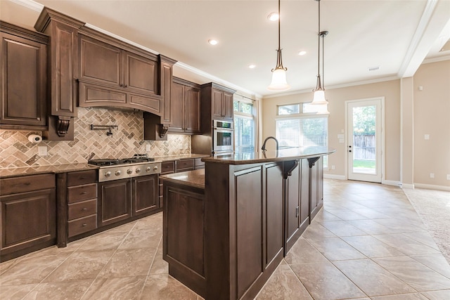 203 Gaillardia Ct, Pinehurst, TX 77362 - kitchen featuring stainless steel gas cooktop, ornamental molding, decorative backsplash, an island with sink, and healthy amount of natural light