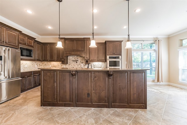 203 Gaillardia Ct, Pinehurst, TX 77362 - kitchen with appliances with stainless steel finishes, crown molding, tasteful backsplash, a center island with sink, and dark brown cabinetry
