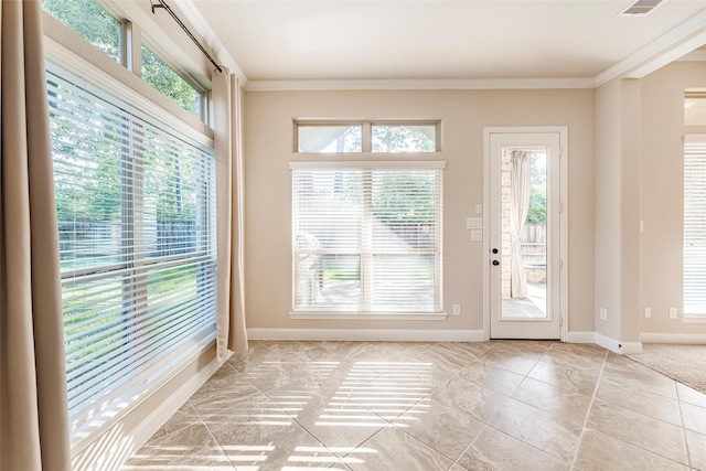203 Gaillardia Ct, Pinehurst, TX 77362 - entryway with healthy amount of natural light, ornamental molding, baseboards, and light tile patterned flooring