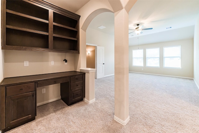 203 Gaillardia Ct, Pinehurst, TX 77362 - unfurnished office featuring a ceiling fan, light carpet, built in desk, and baseboards