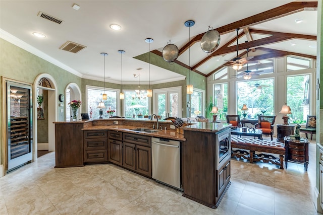 kitchen with lofted ceiling with beams, sink, wine cooler, hanging light fixtures, and appliances with stainless steel finishes